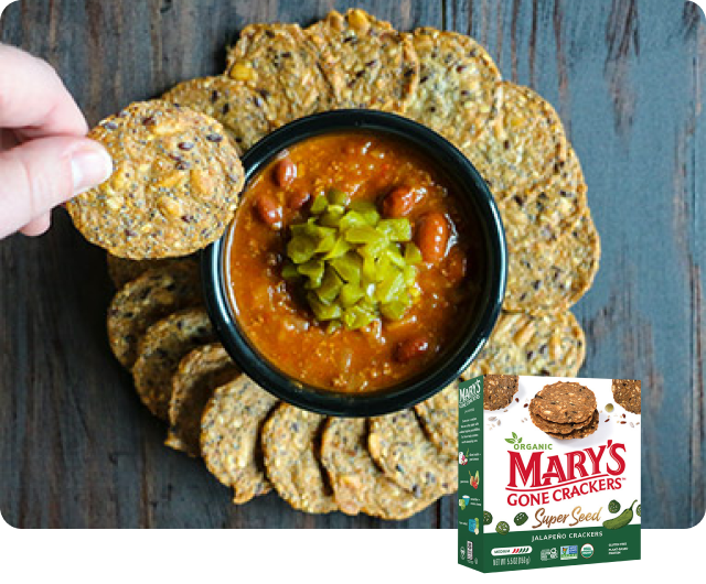 Mary’s Gone Crackers Super Seed Jalapeño Crackers served with a bowl of chili and diced green chiles.