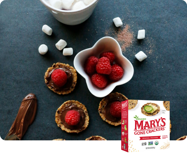Mary’s Gone Crackers Original Crackers served with Nutella® and raspberries.