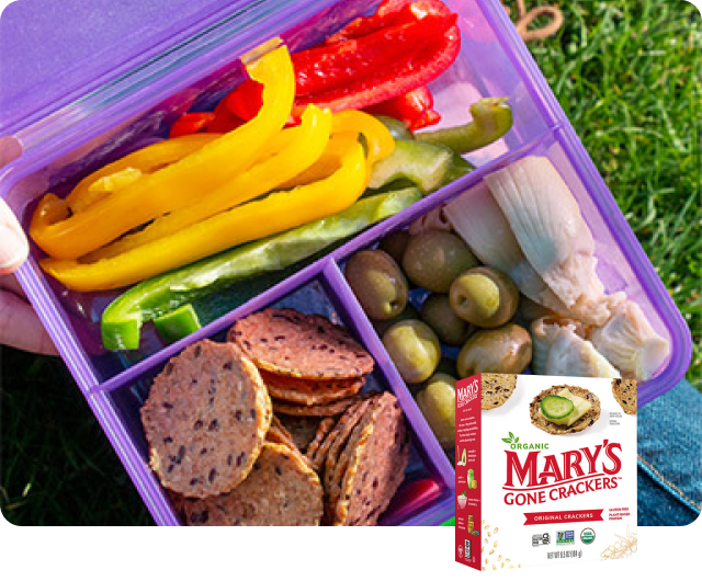 Mary’s Gone Crackers Original Crackers served with sliced bell peppers, olives and marinated artichoke hearts.